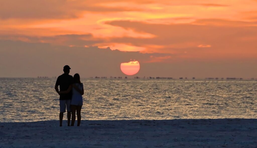married couple watching the Florida sunset